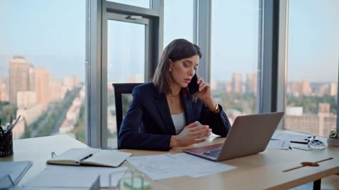 Executive discussing work cellphone looking laptop data at workplace closeup. Stock Footage 319971455