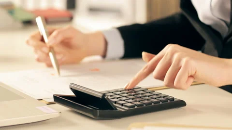 Executive hands doing accounting using calculator Stock Footage 127160772