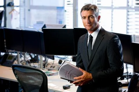 Executive holding documents Stock Photos