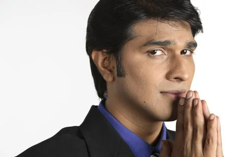 Executive joining hands and touching lips and nose MR#687M Stock Photos