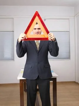 Executive looking through triangular shape MR 779K Copyright: xVirenxDesai... Stock Photos