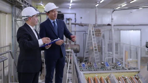 Executive manager and engineer inspecting food processing factory, business.. Stock Footage 318816601