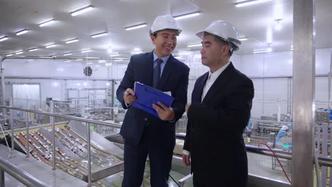 Executive manager and engineer inspecting food processing factory, business.. Stock Footage 319456507