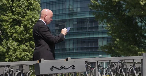 Executive Manager Tablet Browsing Internet Central Building Office Corporation 스톡 동영상 50036279