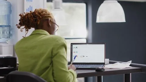 Executive manager taking data notes on papers Stock Photos