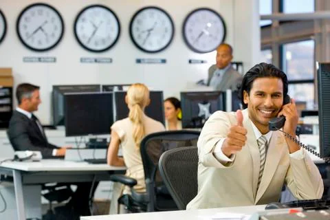 Executive on the phone in open space office Stock Photos