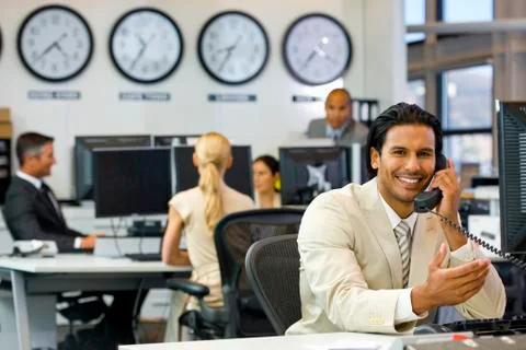 Executive on the phone in open space office Stock Photos