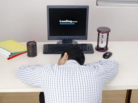 Executive resting on desk work loading on computer MR#779K 스톡 사진