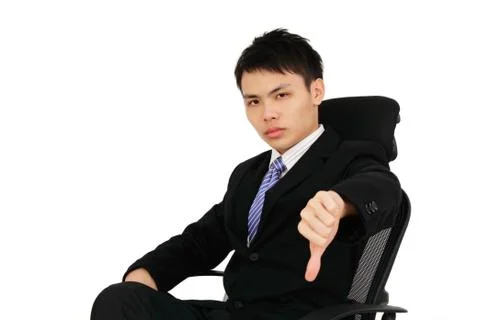 Executive showing thumbs down Foto stock