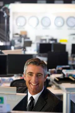 Executive sitting in open space office Foto stock