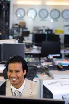 Executive sitting in open space office Stock Photos