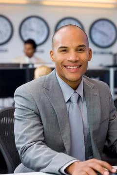 Executive sitting in open space office Stock Photos