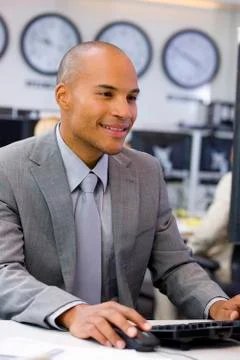 Executive sitting in open space office Stock Photos