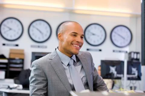 Executive sitting in open space office Foto stock