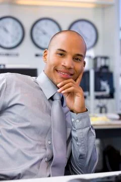 Executive sitting in open space office Stock-Fotos