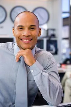 Executive sitting in open space office Stock Photos