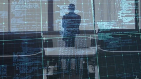 Executive standing at table, sequence starting, code HUD scrolling across him Stock Footage 333211102