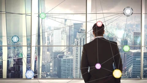 Executive standing at window watching tech network appearing pulsing Stock Footage 317369881