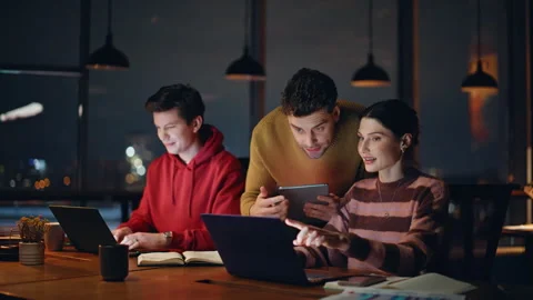 Executive supervising business team working at laptops in dark office closeup. Stock Footage 340112756