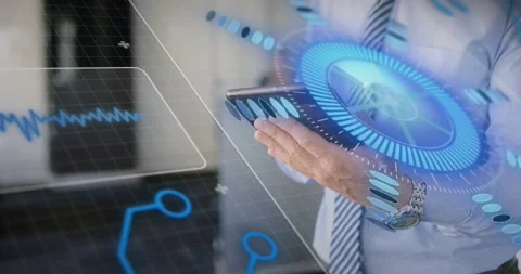 Executive tapping tablet edge and activating holographic UI elements expanding Stock Footage 320287573