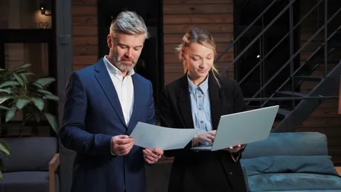 Executive team working with documents negotiating discussing project results. Stock-Footage 232473509