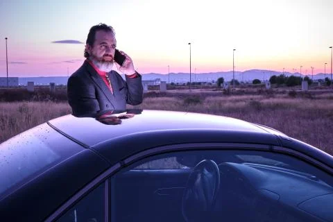 Executive with tie talking on mobile Stock Photos