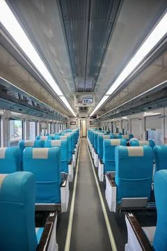 Executive train interior with rows of comfortable seats and an elegant Stock Photos