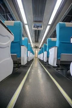 Executive train interior with rows of comfortable seats and an elegant Stock Photos