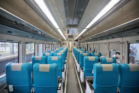 Executive train interior with rows of comfortable seats and an elegant Stock Photos