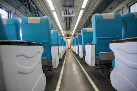 Executive train interior with rows of comfortable seats and an elegant Stock Photos