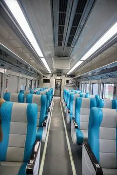 Executive train interior with rows of comfortable seats and an elegant Stock Photos