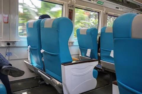 Executive train interior with rows of comfortable seats and an elegant Stock Photos