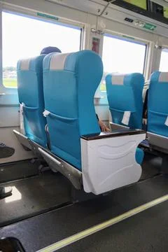 Executive train interior with rows of comfortable seats and an elegant Stock Photos