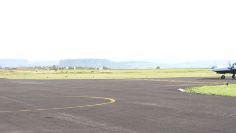 Executive twin-engine airplane taxiing in empty airport Stock Footage 70161885
