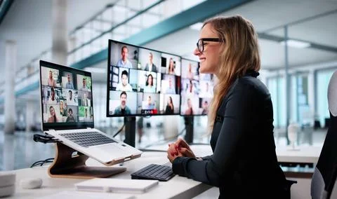Executive Woman Using Laptop In Virtual Conference With Online Solutions Stock Photos