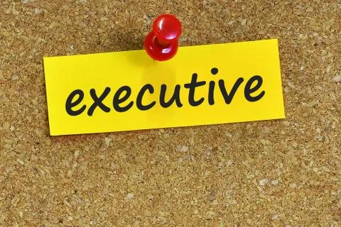 Executive    word on notes paper with cork background Stock Photos