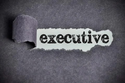 Executive word under torn black sugar paper Stock Photos