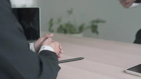 Executives accept job application documents and read job applicants resume to Video stock 164388128