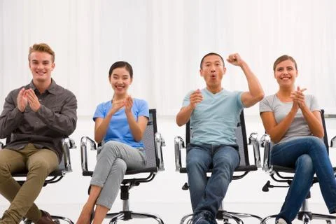 Executives applauding and cheering office Stock Photos