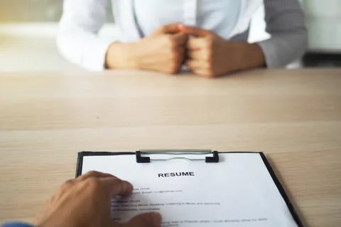 Executives are interviewing. Focus on resume writing tips, candidate qualific Stock Photos