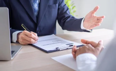 Executives are interviewing job applicants and conducting background checks.  Foto stock