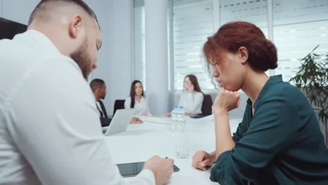 Executives discussing company progress at meeting Stock Footage 155641915