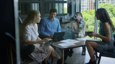 Executives discussing with each other in office 스톡 동영상 75451698