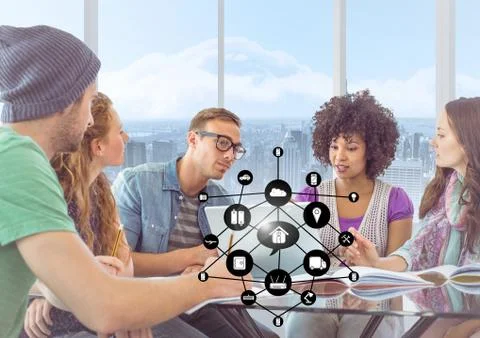 Executives discussing over digital tablet in office and networking icons Stock Photos