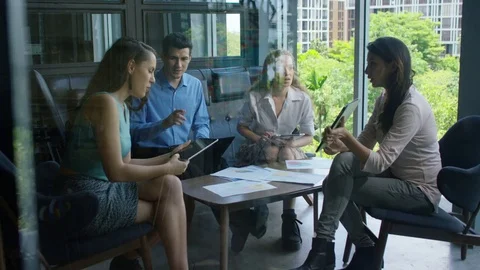 Executives discussing over document in office Stock-Footage 75451804