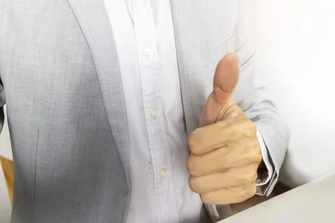 Executives give a thumbs up to show appreciation and encouragement for thei.. Stock Photos