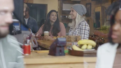 Executives having discussion while customers collectingir order from counter Stock Footage 108011739