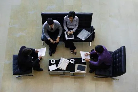 Executives having a meeting, overhead view Foto stock