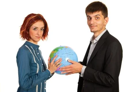 Executives holding world globe Foto stock