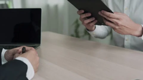 Executives review information on resume to match the job position. company publi Video stock 164388915